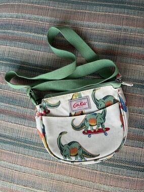 Cath Kidston Cream Kids Dinosaur Skateboard Crossbody Bag with Green Strap
